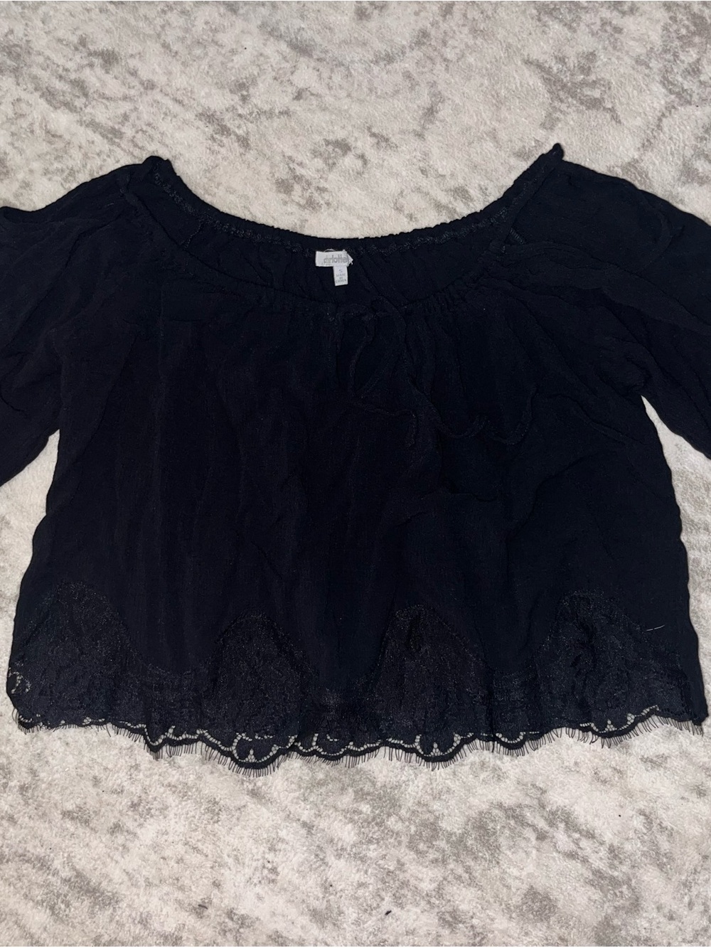 woman’s small cropped shirt